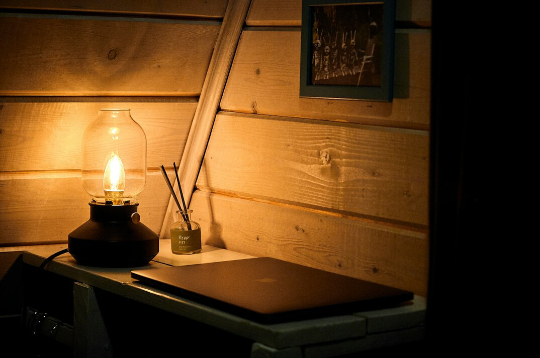 Writing desk with notebook and warm lamp