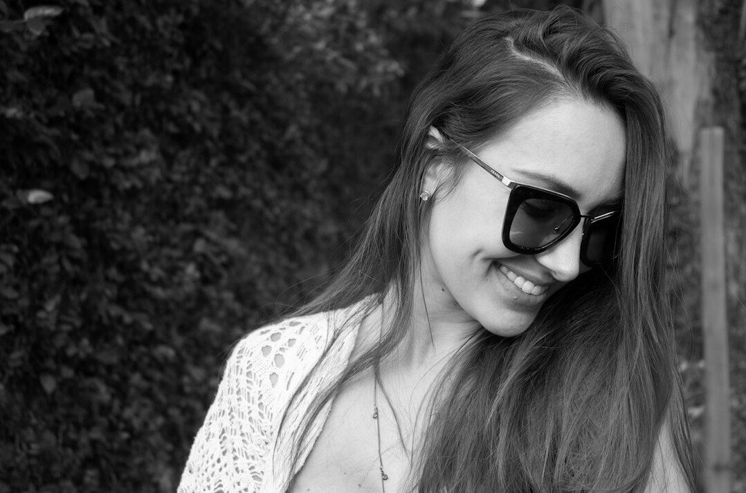 Portrait of a young woman with long hair smiling