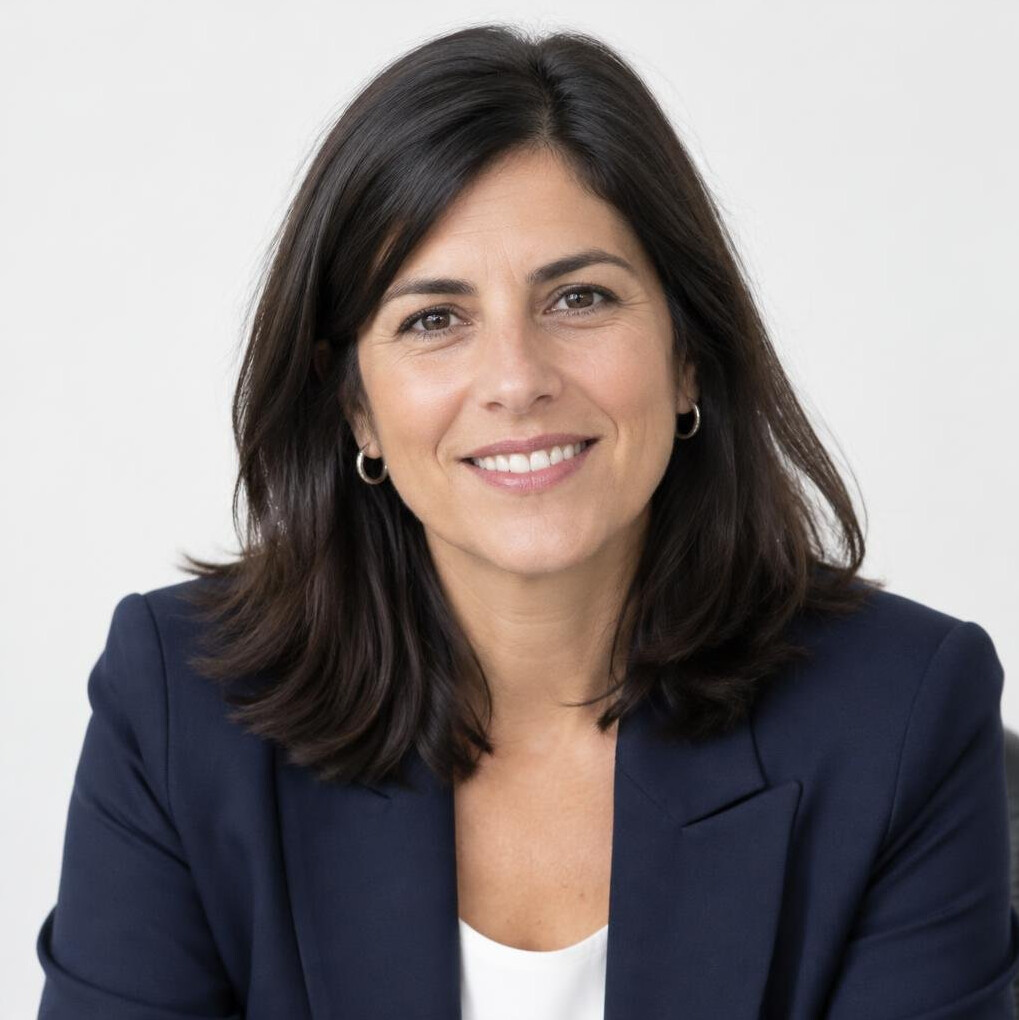 Portrait of a smiling Latina woman in a blazer