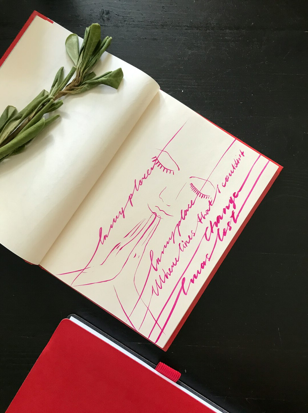 Open notebook with handwritten notes and a pen